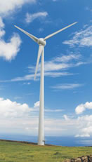 Wind turbine in blue and white cloudy sky