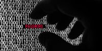 A black silhouette of a hand grabbing the word Password on a binary code computer screen A black silhouette of a hand grabbing the word Password on a binary code computer screen