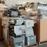 A bin full of old computers and printers for recycling A bin full of old computers and printers for recycling