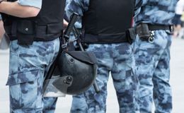 Camouflaged people wearing body armor vests Camouflaged people wearing body armor vests