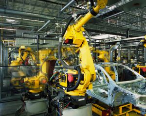 Car on assembly line with robot arms working Car on assembly line with robot arms working